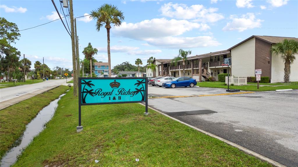 A sign for Royal Richey I & II stands in front of a multi-story apartment building — 5521 BAY BOULEVARD UNIT 103, PORT RICHEY, FL