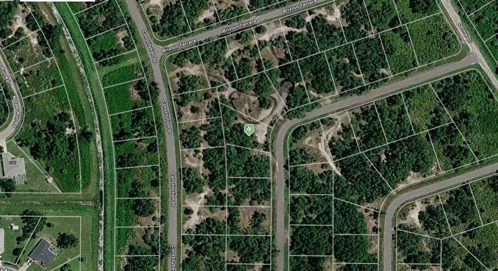 This is an aerial map view of a vacant residential lot in a wooded area — HAMER TERRACE Lot 25, NORTH PORT, FL