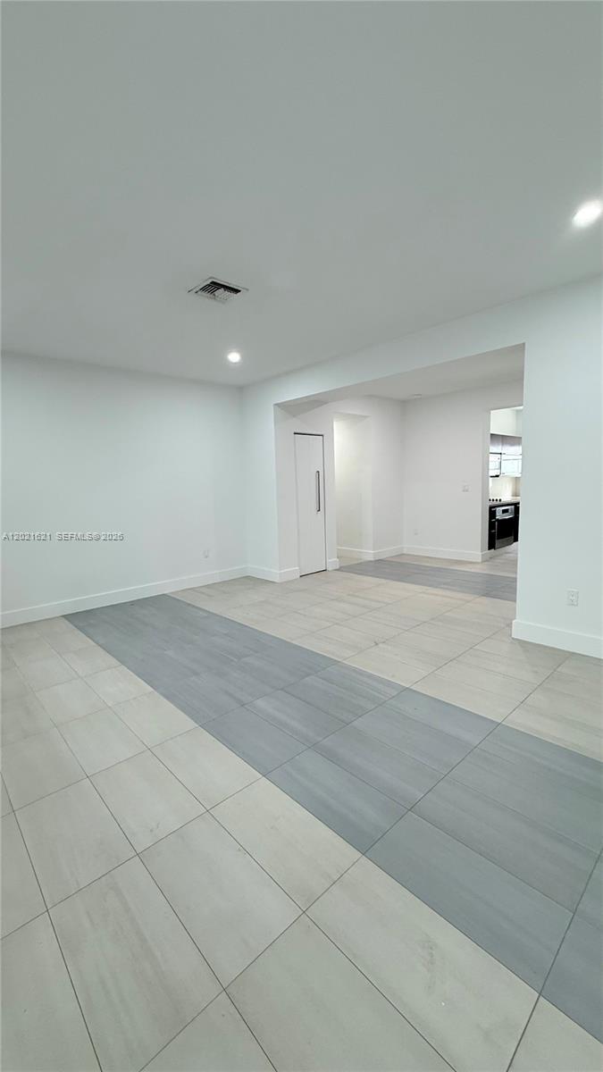 This interior space features white walls, recessed lighting, and light-colored tile flooring — 2021 Meridian Ave # 6, Miami Beach FL 33139, MIAMI BEACH, FL