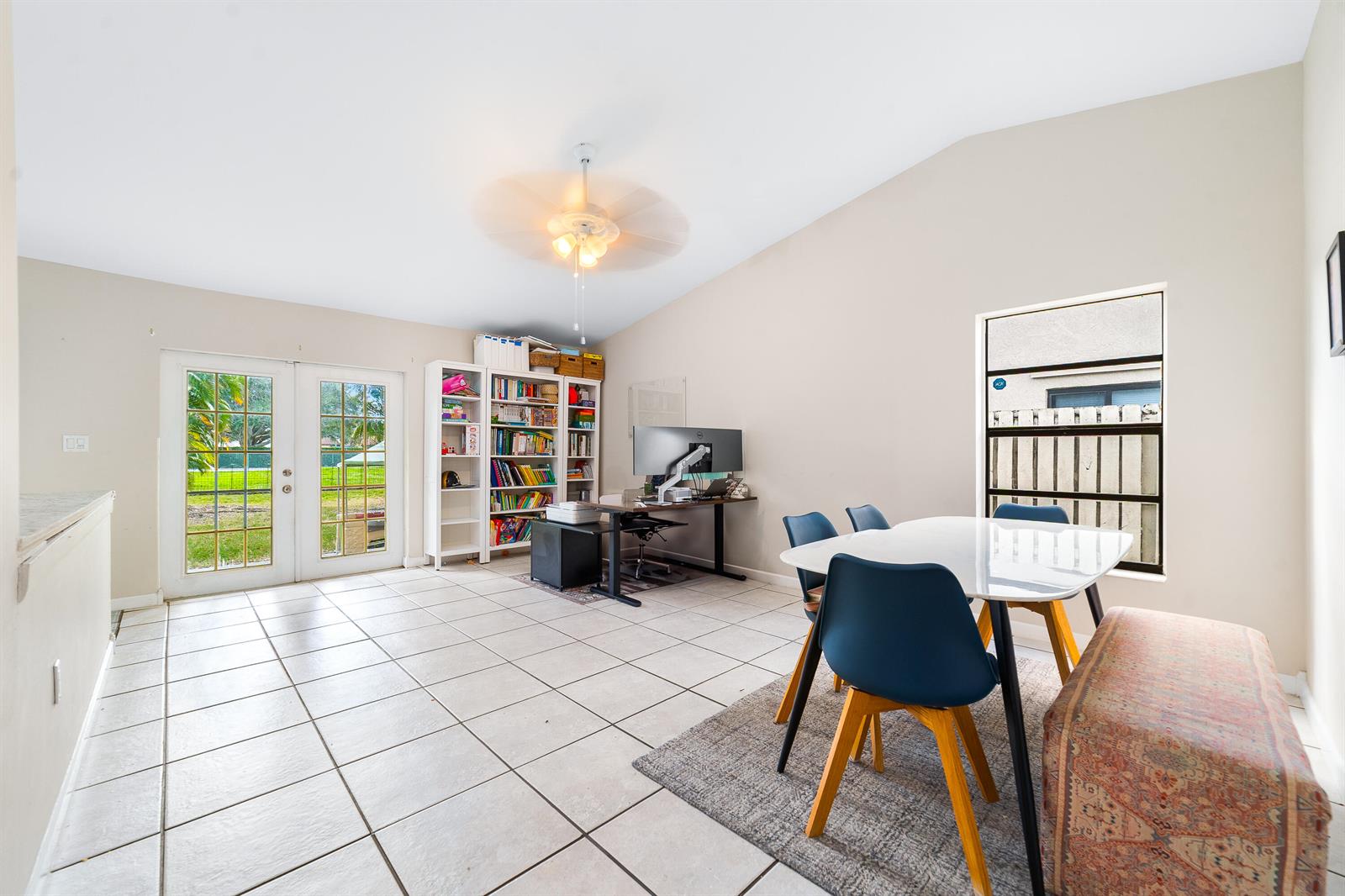 A room with tile floors, a dining set, a desk, and a bookshelf near glass doors — 1060 Cedar Creek Way, Davie FL 33325, DAVIE, FL