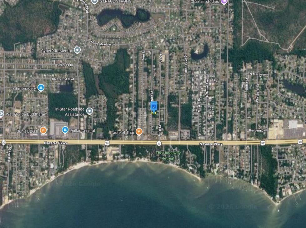 This is an aerial map view of a residential area near a coastline — 2160 NINA STREET, NAVARRE, FL