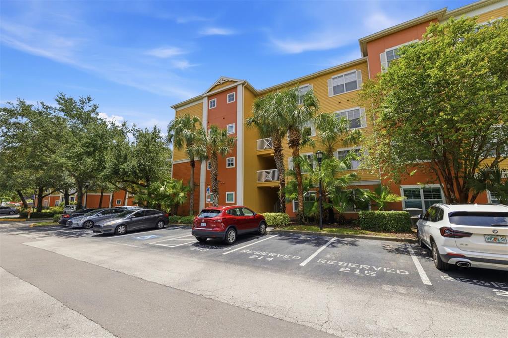 A multi-story apartment building with a parking lot in front featuring reserved parking spaces — 4207 S DALE MABRY HIGHWAY UNIT 2305, TAMPA, FL