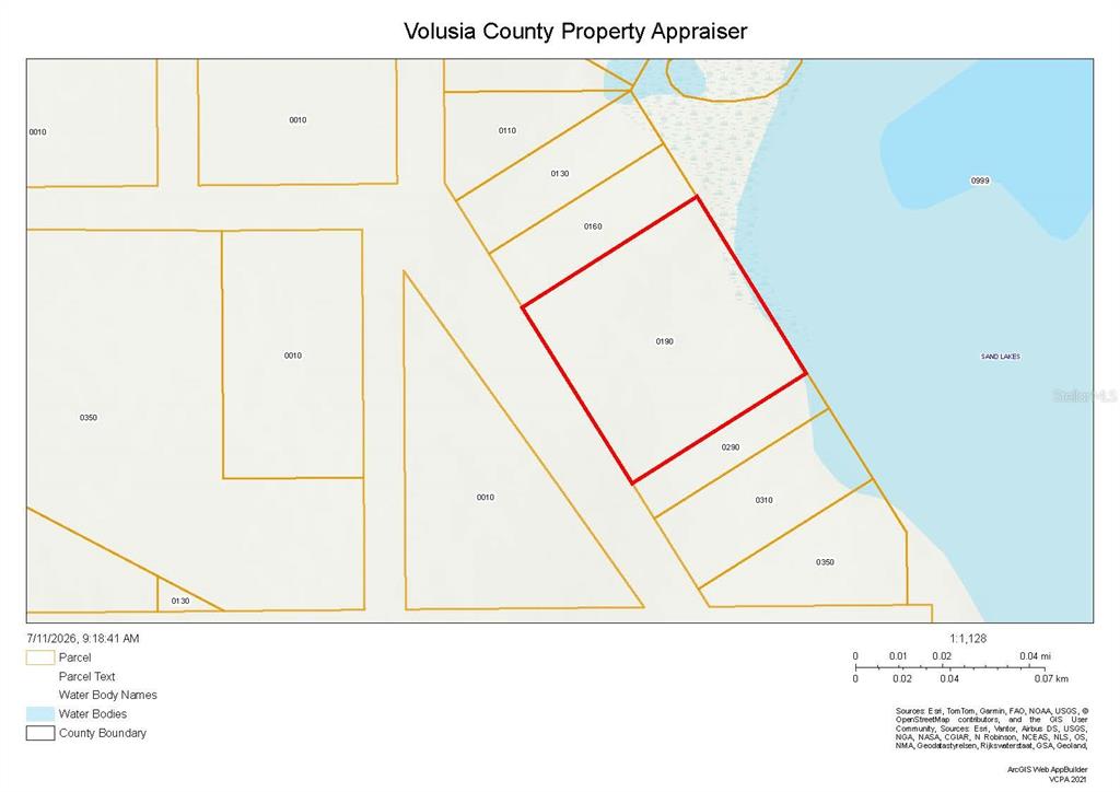 This is a property tax map showing parcel boundaries and water bodies in Volusia County — COLBY (PAPER) DRIVE, DELTONA, FL