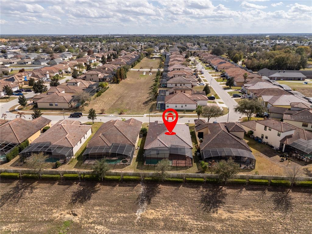 An aerial view shows a suburban neighborhood with a red house icon marking a specific home — 355 VILLA SORRENTO CIRCLE, HAINES CITY, FL