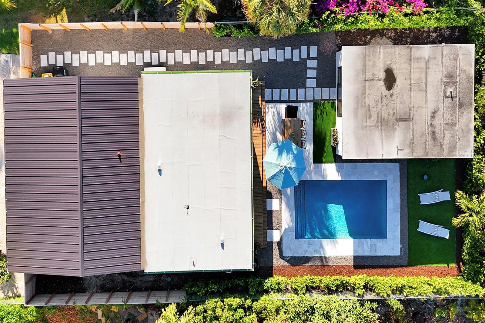 An aerial view shows a house with a pool, patio, and landscaped backyard — 225 NE 10th Street, Delray Beach FL 33444, DELRAY BEACH, FL