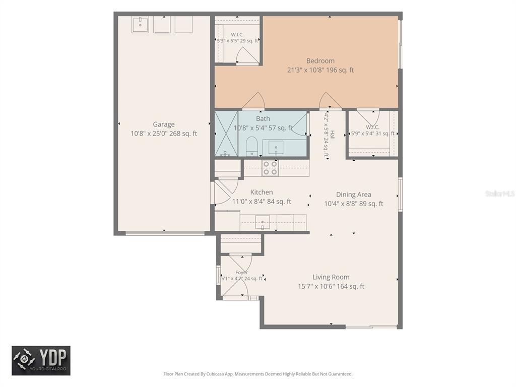 A beige house exterior features a brick-paved walkway, a white front door, and a garage — 2735 SHERBROOKE LANE UNIT C, PALM HARBOR, FL