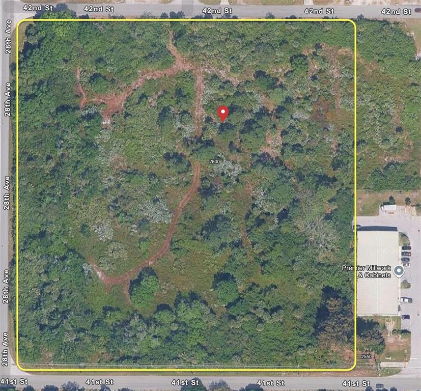 An aerial map shows a large, undeveloped, rectangular plot of land covered in dense vegetation — 2600 41ST STREET, VERO BEACH, FL