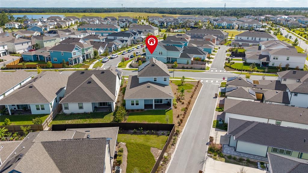 An aerial view shows a suburban neighborhood with houses, streets, and a red location pin — 6515 QUEST STREET, ST CLOUD, FL