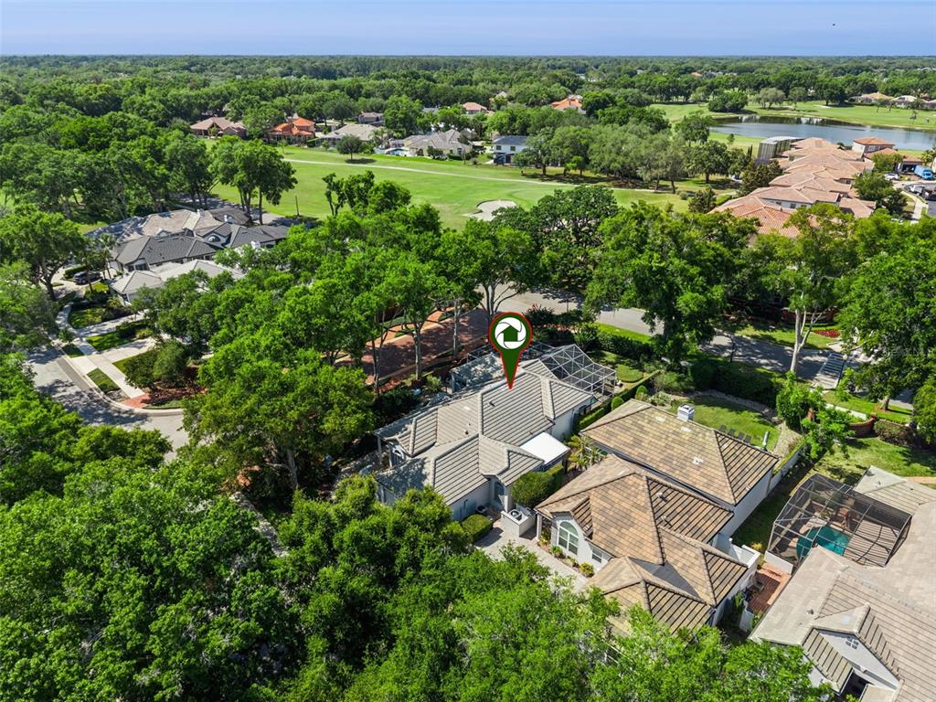 A screened-in pool area features a circular hot tub and a rectangular swimming pool — 1250 E LANGLEY COURT, LAKE MARY, FL