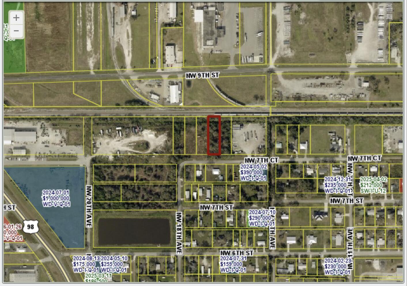 This is a satellite map view showing a highlighted rectangular parcel of land near railroad tracks — . NW 7th Court, Okeechobee FL 34972, OKEECHOBEE, FL