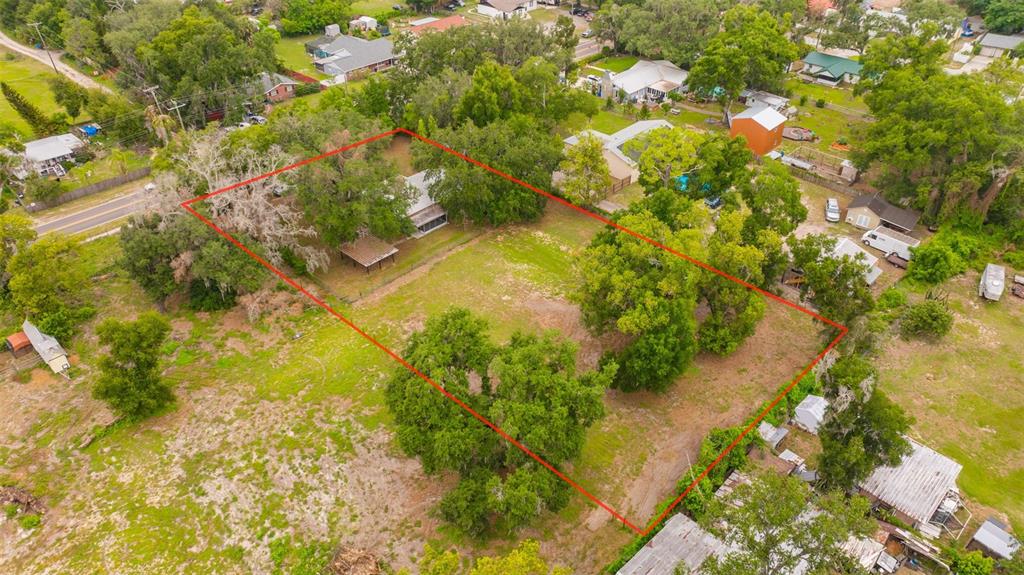 An aerial view shows a house on a large, tree-filled lot outlined in red — 308 S KINGSWAY ROAD, SEFFNER, FL