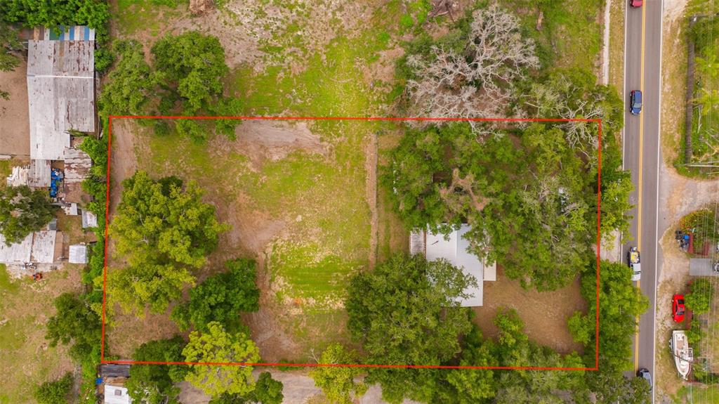 An aerial view shows a rectangular lot with a house, trees, and open grassy areas — 308 S KINGSWAY ROAD, SEFFNER, FL