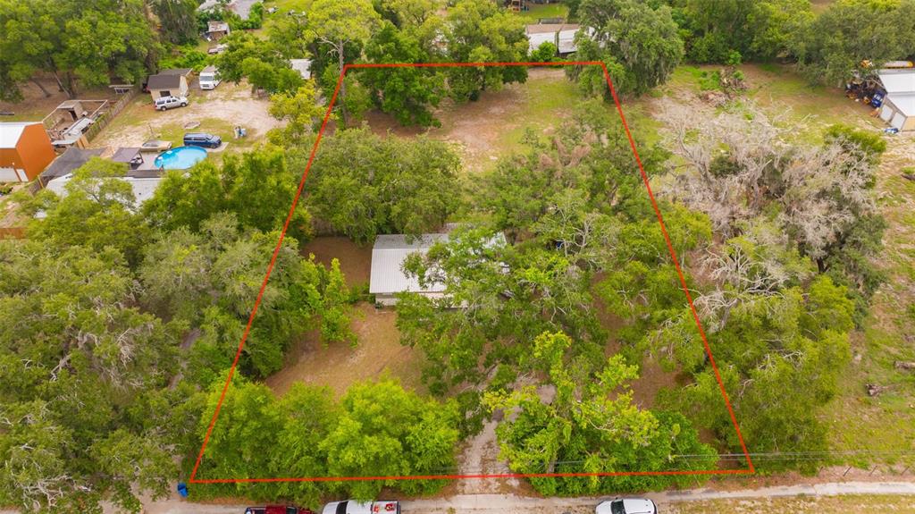 An aerial view shows a house nestled among mature trees on a large, rectangular lot — 308 S KINGSWAY ROAD, SEFFNER, FL