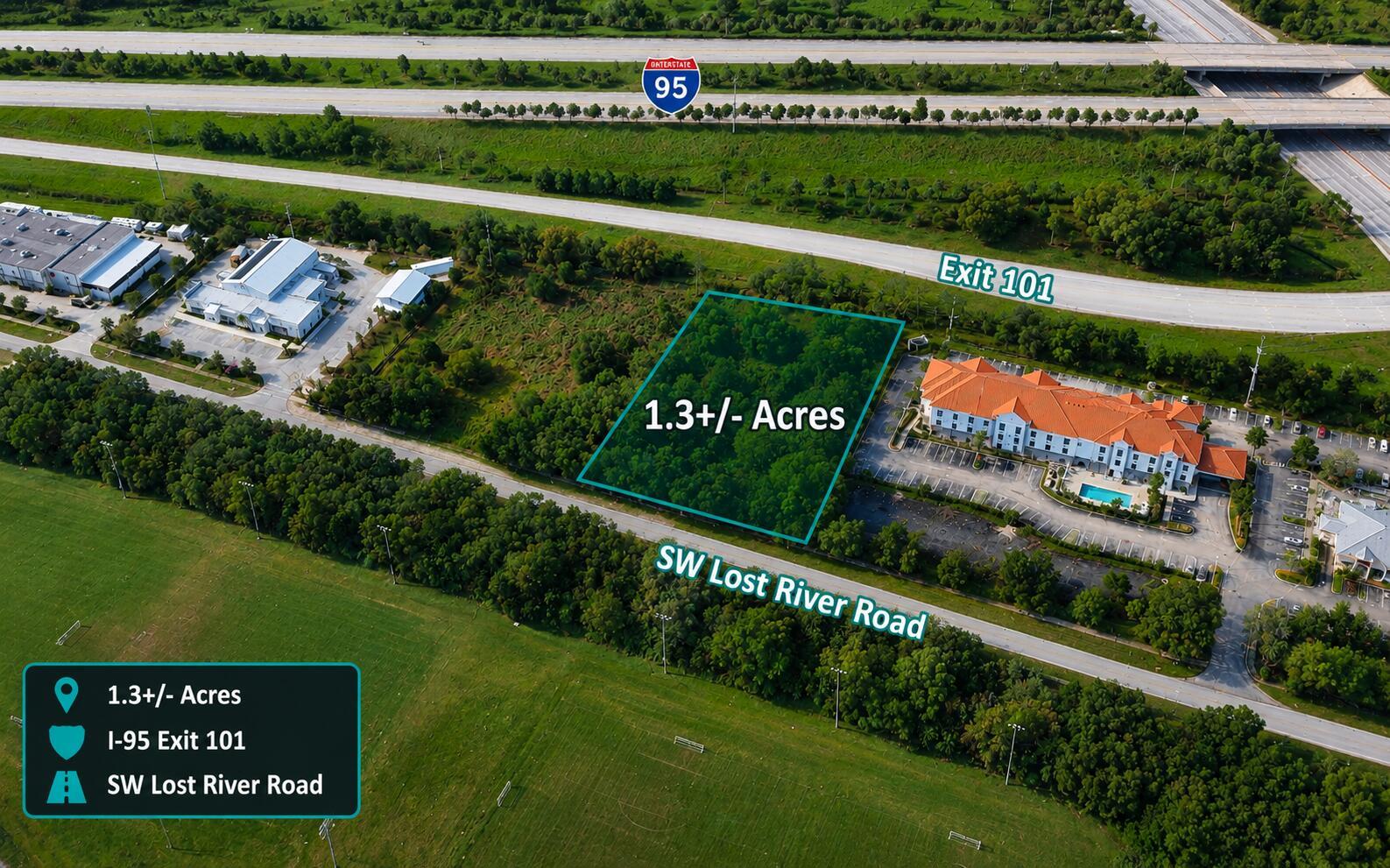 An aerial view shows a vacant 1.3-acre wooded lot located near I-95 Exit 101 — 8000 SW Lost River Road, Stuart FL 34997, STUART, FL