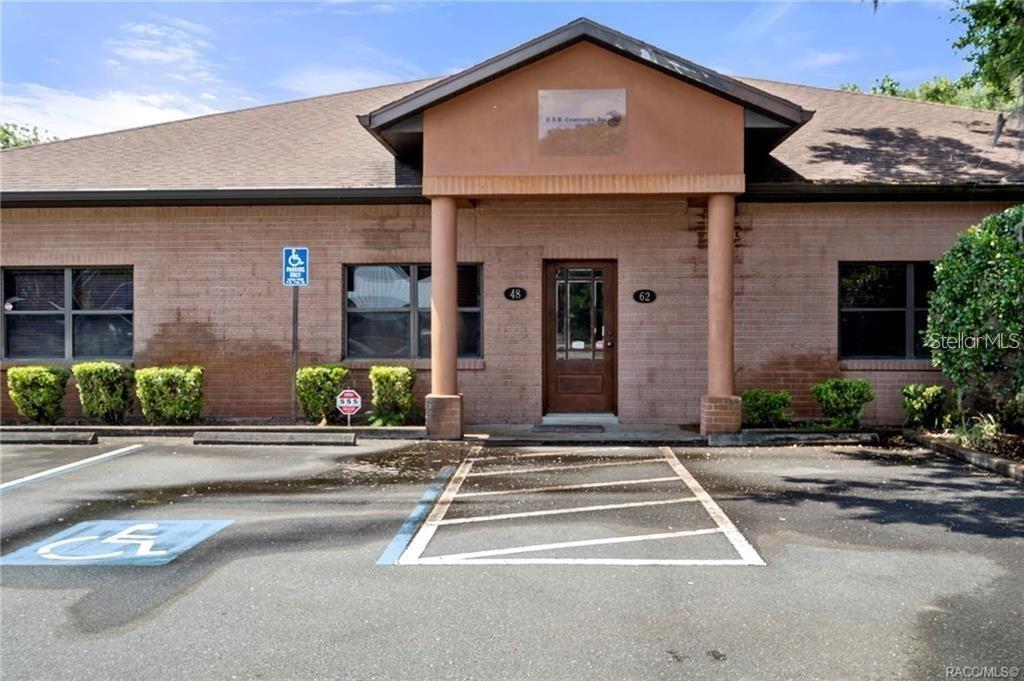 A single-story brick commercial building with a covered entrance and a handicap-accessible parking space — 0 SE 78TH PLACE, TRENTON, FL