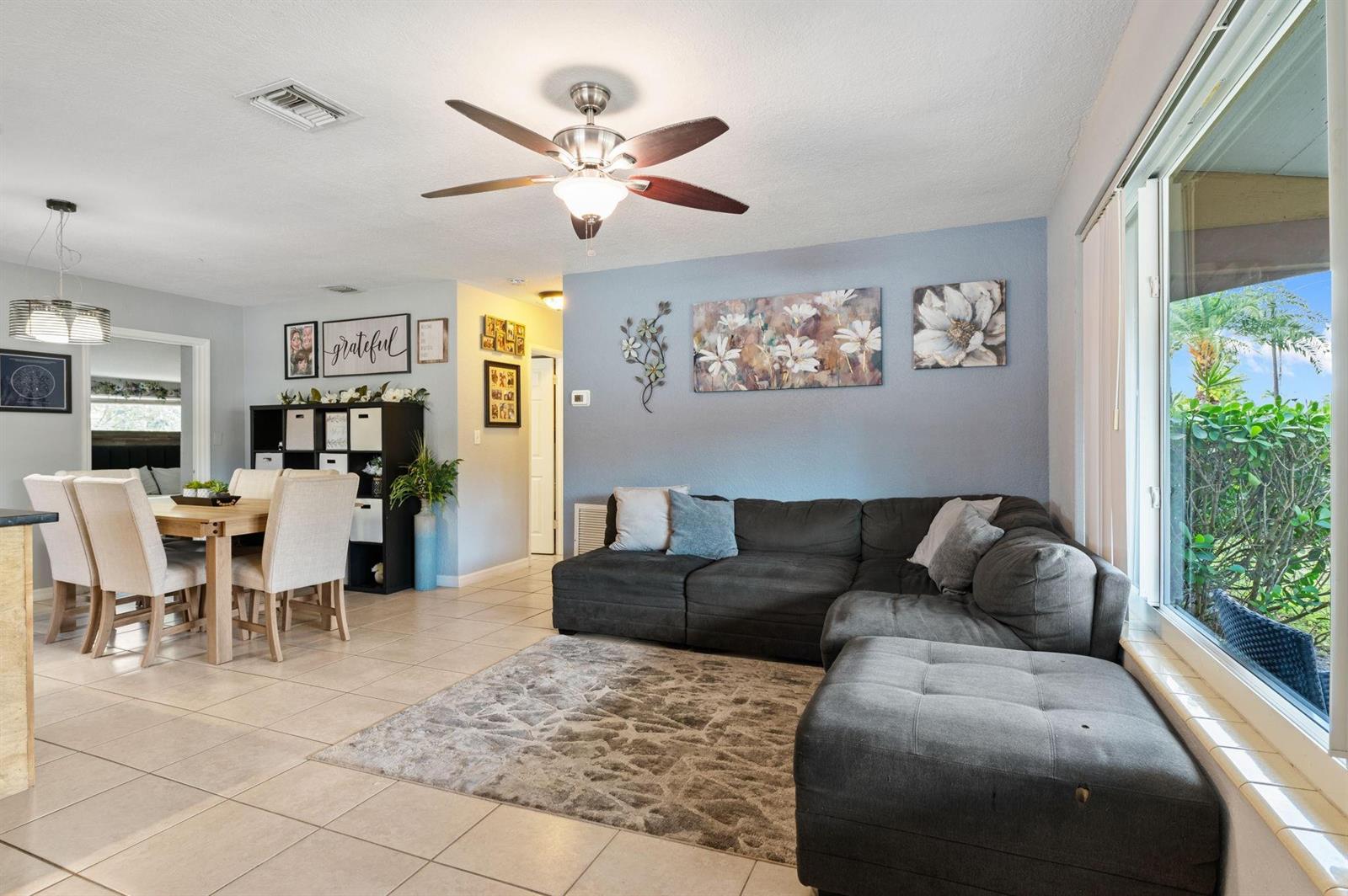 A living room and dining area feature tile floors, a sectional sofa, and a ceiling fan — 5554 SW 6th Street, Margate FL 33068, MARGATE, FL