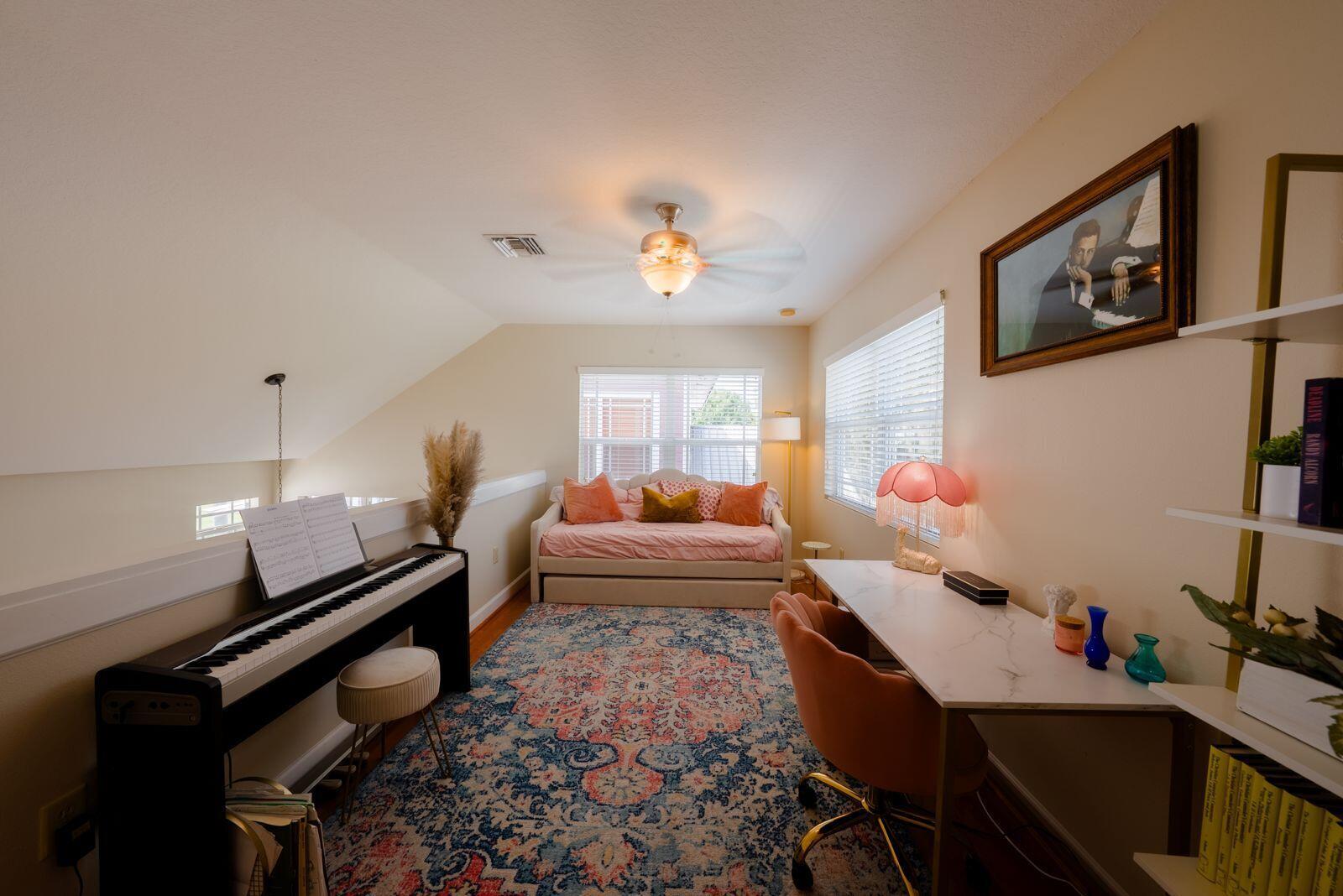 A room featuring a piano, a daybed, a desk, and a large patterned area rug — 4334 Us-441, Okeechobee FL 34974, OKEECHOBEE, FL