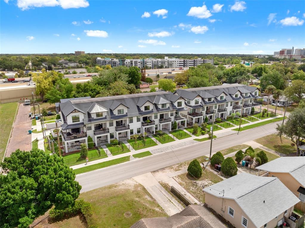 An aerial view of a multi-unit townhouse complex with a street in the foreground — 1250 FORMOSA AVENUE, WINTER PARK, FL