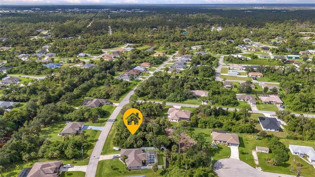 An aerial view shows a residential neighborhood with a yellow house icon marking a lot — HIGHTOWER ROAD, NORTH PORT, FL