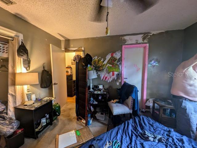 A bedroom features a desk, a bed, a doorway, and wall art — 4345 OLD COLONY ROAD, MULBERRY, FL