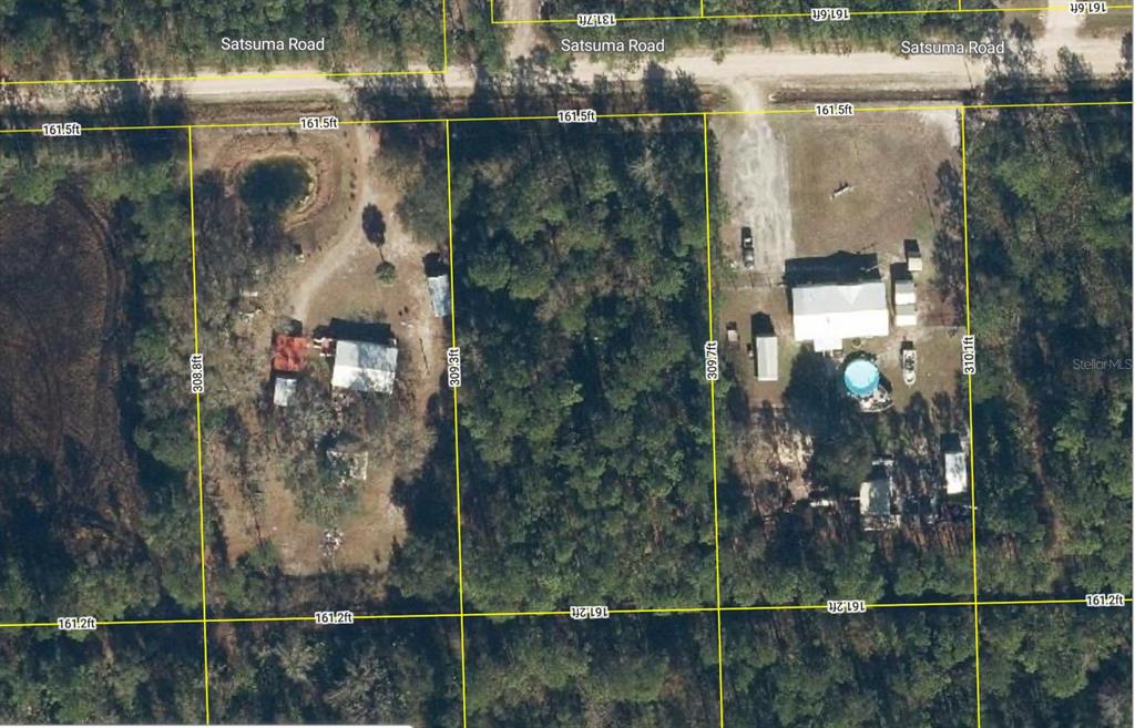 This aerial map shows two adjacent residential lots with structures, driveways, and trees along Satsuma Road — 127 E SATSUMA STREET, PALATKA, FL