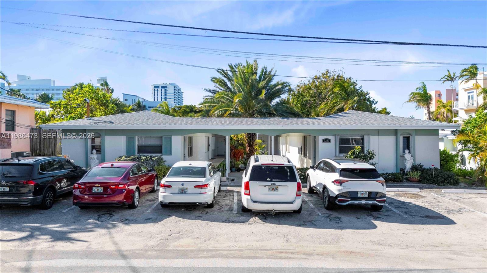 A single-story building with a covered walkway and five parked cars in front — 3240 NE 16th St # 3, Pompano Beach FL 33062, POMPANO BEACH, FL