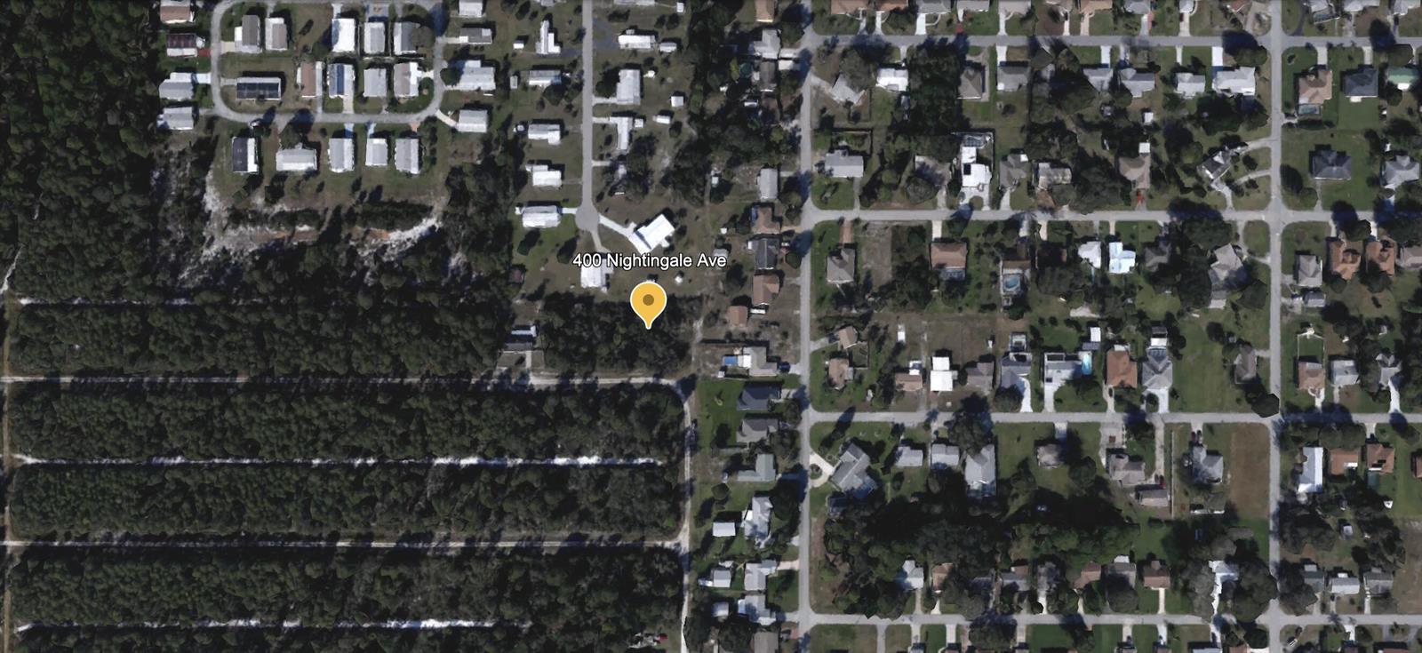 This is a satellite map view of a residential property and its surrounding neighborhood — 400 Nightingale Avenue, FL 33870, FL