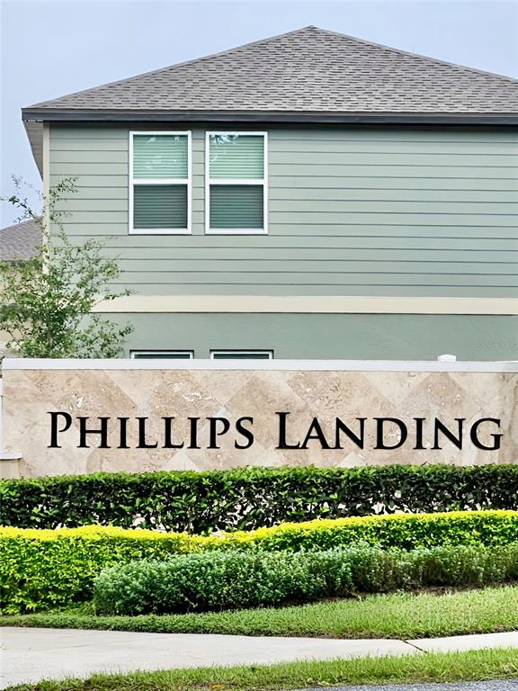 A stone sign reading Phillips Landing sits in front of a light green two-story building — 1991 HEMINGWAY CIRCLE, GROVELAND, FL