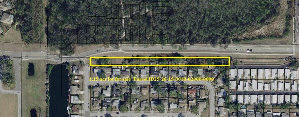 An aerial map shows a rectangular 1.15-acre lot highlighted in yellow next to a residential neighborhood — LECANTO STREET, HOLIDAY, FL