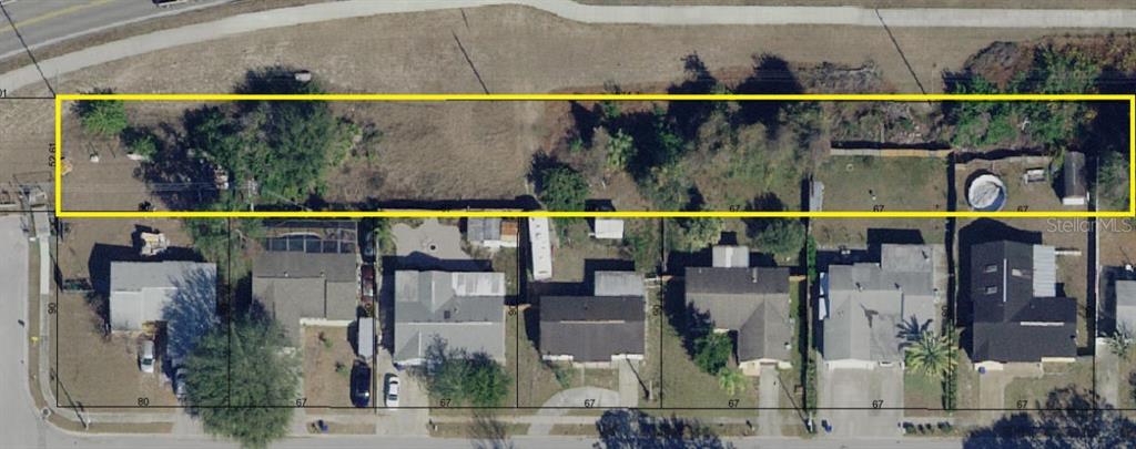 This aerial view shows a row of residential lots with a highlighted vacant strip above — LECANTO STREET, HOLIDAY, FL