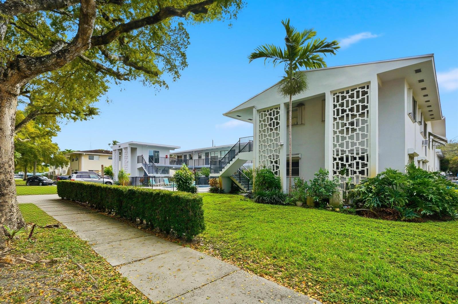 A two-story apartment building with decorative concrete screens and an outdoor staircase — 3510 Harrison Street # 4, Hollywood FL 33021, HOLLYWOOD, FL