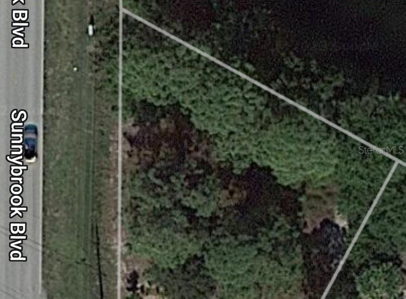 This is an aerial map view of a vacant, wooded lot bordering a road — 7320 ROSEMONT DRIVE, ENGLEWOOD, FL