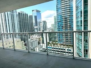 A view of city skyscrapers from a balcony with a white metal railing — 1200 Brickell Bay Dr # 3318, Miami FL 33131, MIAMI, FL