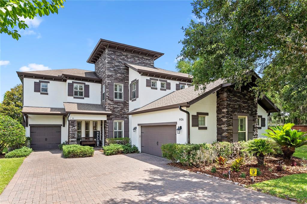 An entryway features hardwood floors, white walls, plantation shutters, and a wooden chest — 906 SHERBOURNE CIRCLE, LAKE MARY, FL