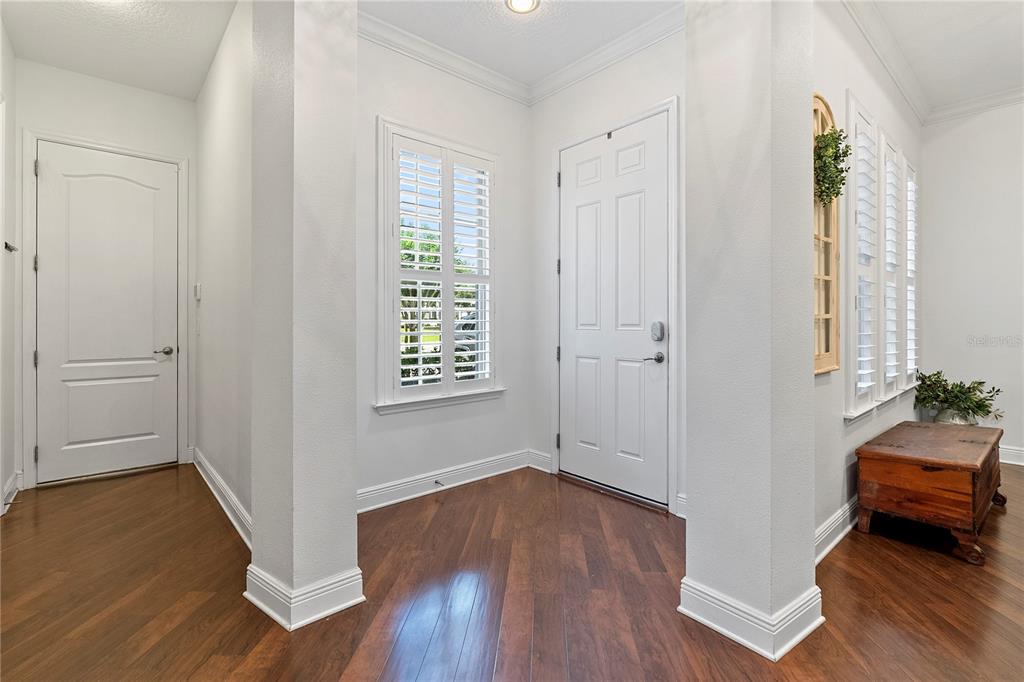A kitchen features dark wood cabinets, granite countertops, a large island, and white subway tile — 906 SHERBOURNE CIRCLE, LAKE MARY, FL