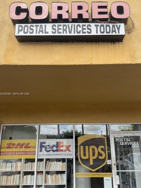 The exterior of a storefront features signage for a postal services business with shipping logos — XXXX W 16th Ave, Hialeah FL 33012, HIALEAH, FL