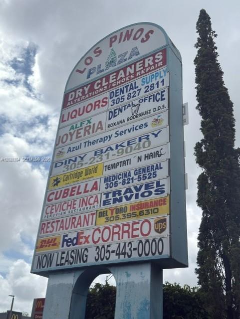 A tall, multi-tenant commercial plaza sign stands against a cloudy sky — XXXX W 16th Ave, Hialeah FL 33012, HIALEAH, FL