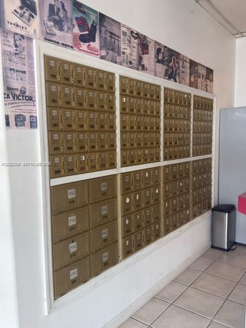 A wall of metal mailboxes is mounted in a room with tiled floors — XXXX W 16th Ave, Hialeah FL 33012, HIALEAH, FL