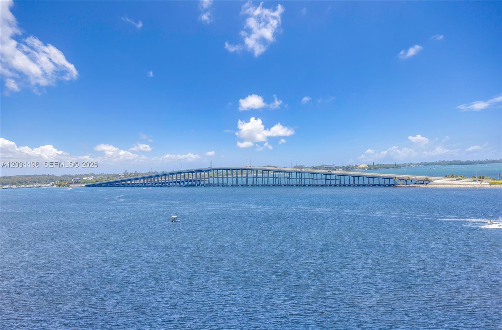 A long bridge spans across a wide body of water under a blue sky — 2101 Brickell Ave # 605, Miami FL 33129, MIAMI, FL
