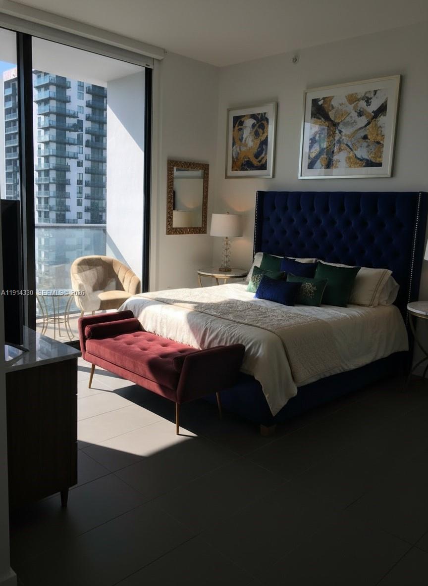 An elevated view of the Miami skyline features numerous high-rise buildings and a large bridge — 1600 NE 1st Ave # 2508, Miami FL 33132, MIAMI, FL