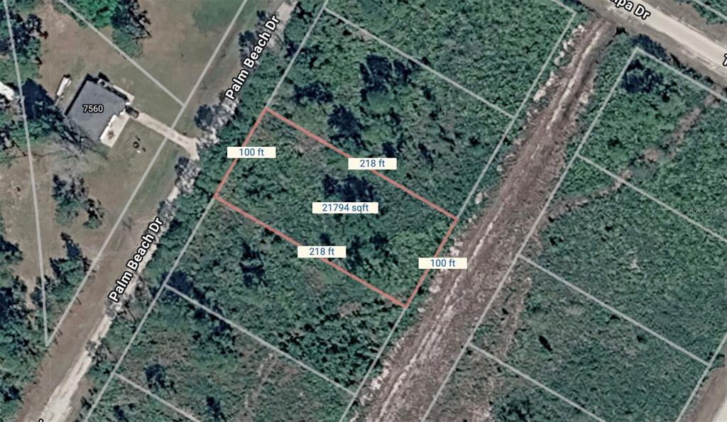 An aerial view shows a rectangular plot of land with dimensions labeled on a map — PALM BEACH DRIVE, INDIAN LAKE ESTATES, FL