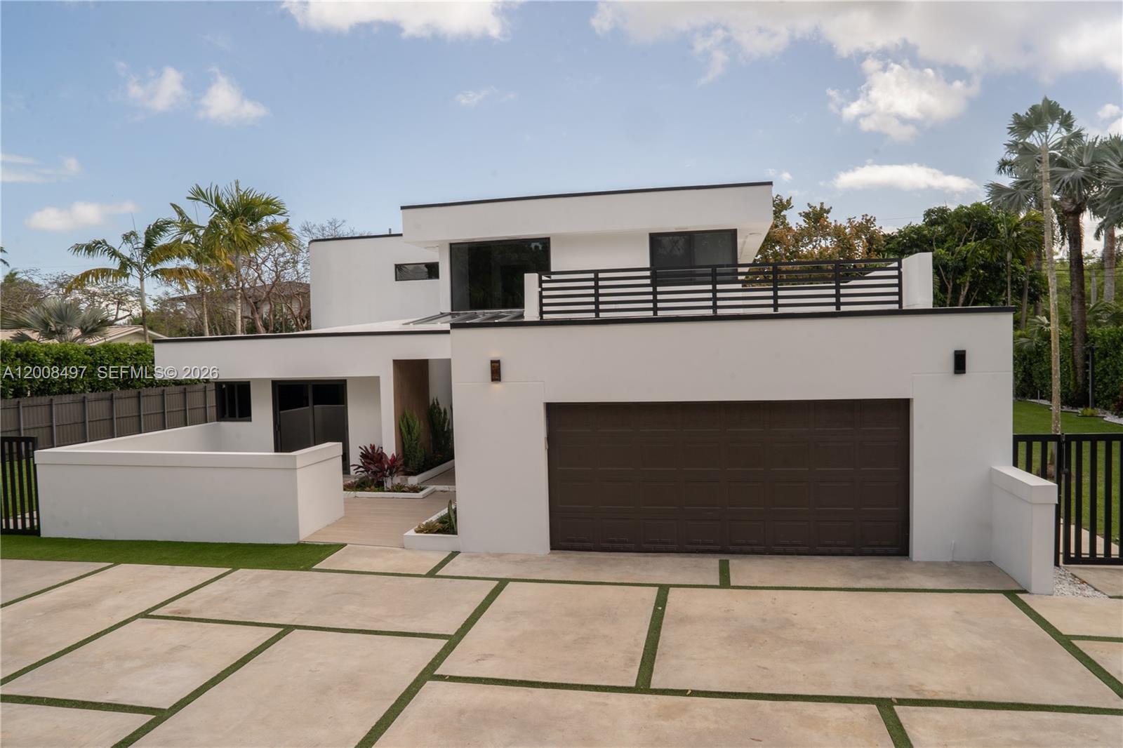 A modern two-story white house features a brown garage door and a paved driveway — 10475 SW 72nd Ave, Pinecrest FL 33156, PINECREST, FL