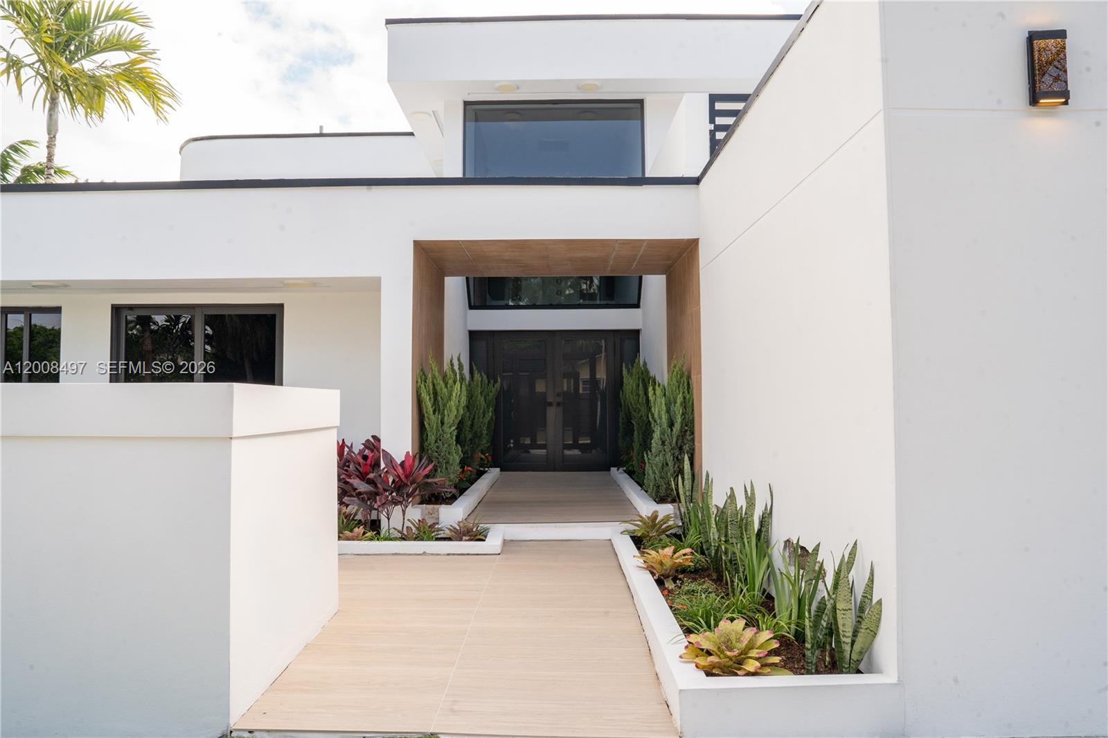 A modern two-story house features a white exterior, a brown garage door, and a driveway — 10475 SW 72nd Ave, Pinecrest FL 33156, PINECREST, FL