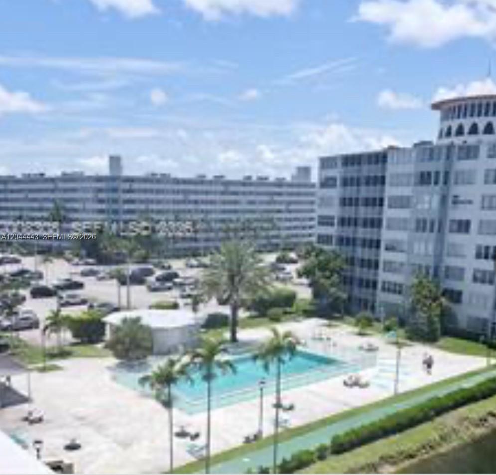 An elevated view shows a swimming pool, parking lot, and multi-story apartment buildings — 1780 NE 191st St # 2, Miami FL 33179, MIAMI, FL