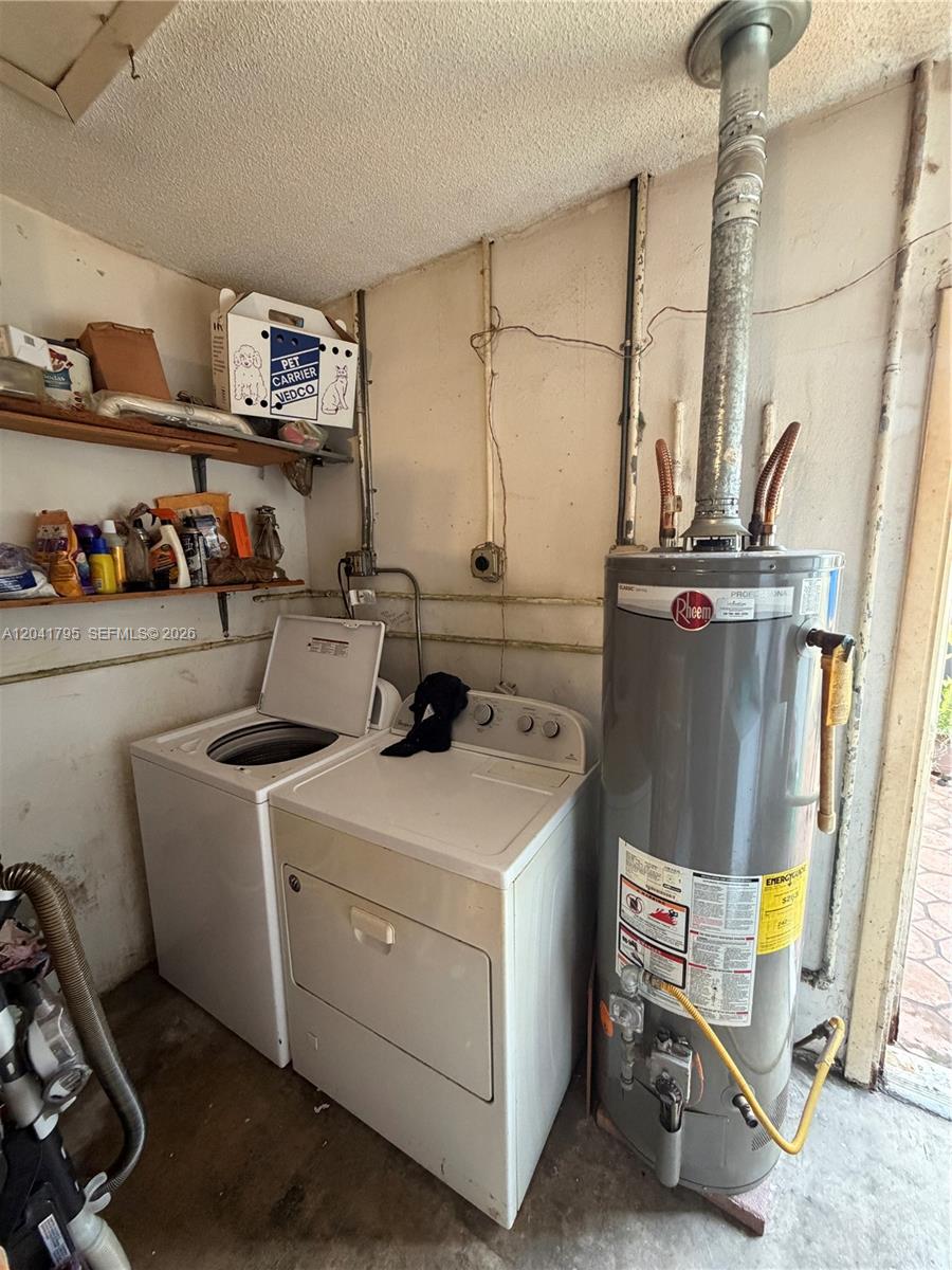 A laundry area features a washing machine, a dryer, and a water heater — 11511 SW 83rd Ter, Miami FL 33173, MIAMI, FL