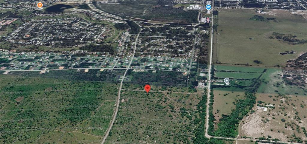 This aerial map shows a red location pin on a vacant, undeveloped plot of land — 4021 PALERMO AVENUE, SEBRING, FL