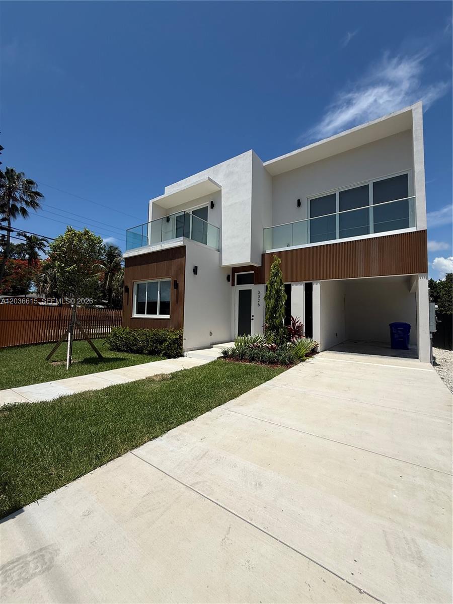 A modern two-story house features white stucco walls, wood-paneled accents, and glass balcony railings — 3326 Elizabeth St, Miami FL 33133, MIAMI, FL