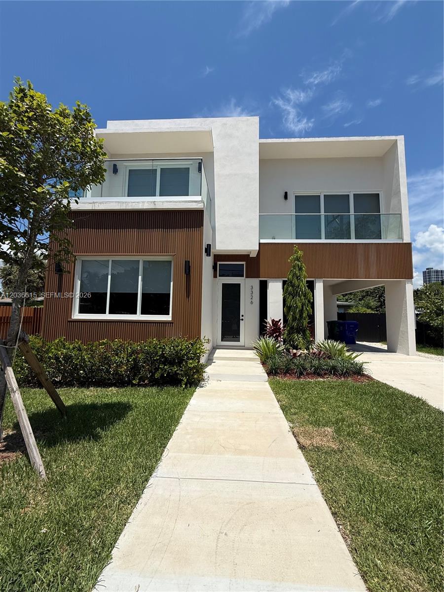 A modern two-story house features white stucco walls, wood-slat siding, and glass-railed balconies — 3326 Elizabeth St, Miami FL 33133, MIAMI, FL