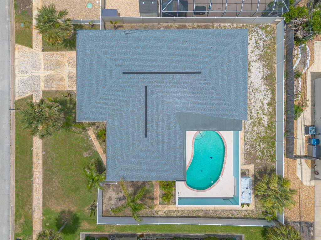 An aerial view shows a house with a shingled roof and a backyard swimming pool — 2315 BONNIE VIEW DRIVE, ORMOND BEACH, FL