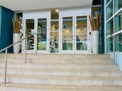 A set of stone stairs leads up to a glass-paned double door entrance — 1900 N Bayshore Drive # 1705, Miami FL 33132, MIAMI, FL